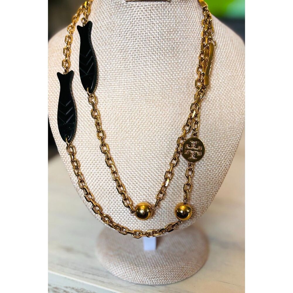 Tory Burch Gold Tone Long Station Necklace Black Fish Charms Logo Medallion